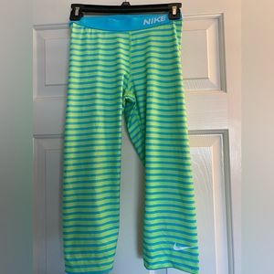 Bright lime green and blue striped Nike Pro tights.